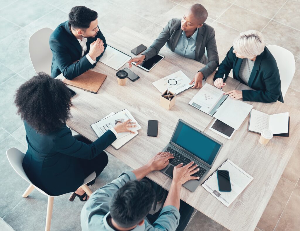 A group of professionals sitting while discussing a business development plan