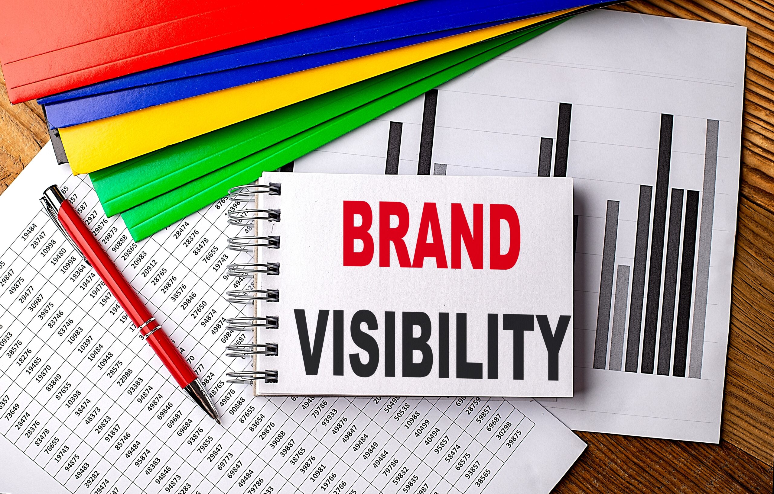 "Brand Visibility" text written on a notebook