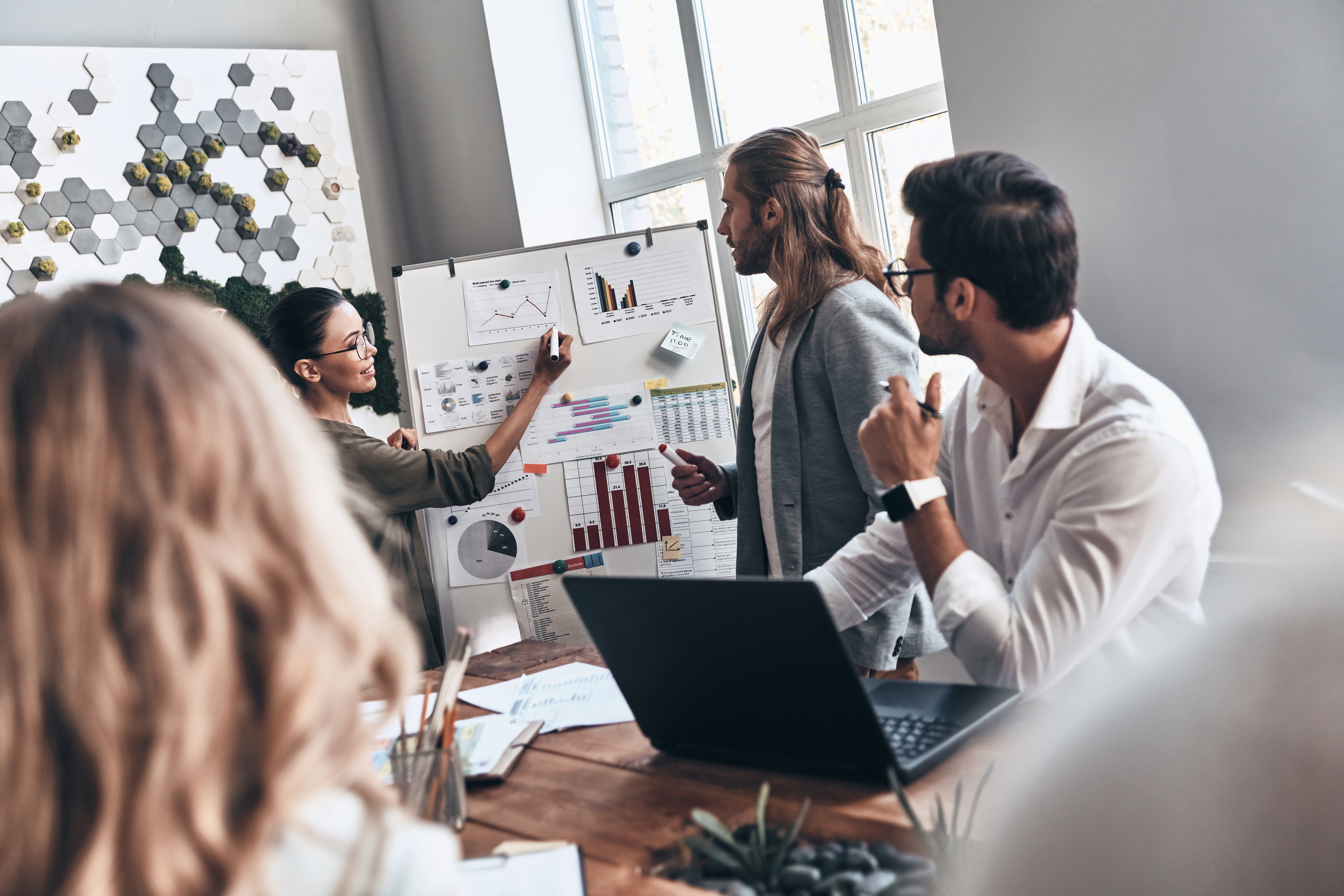 A marketing team working together about business growth solutions.