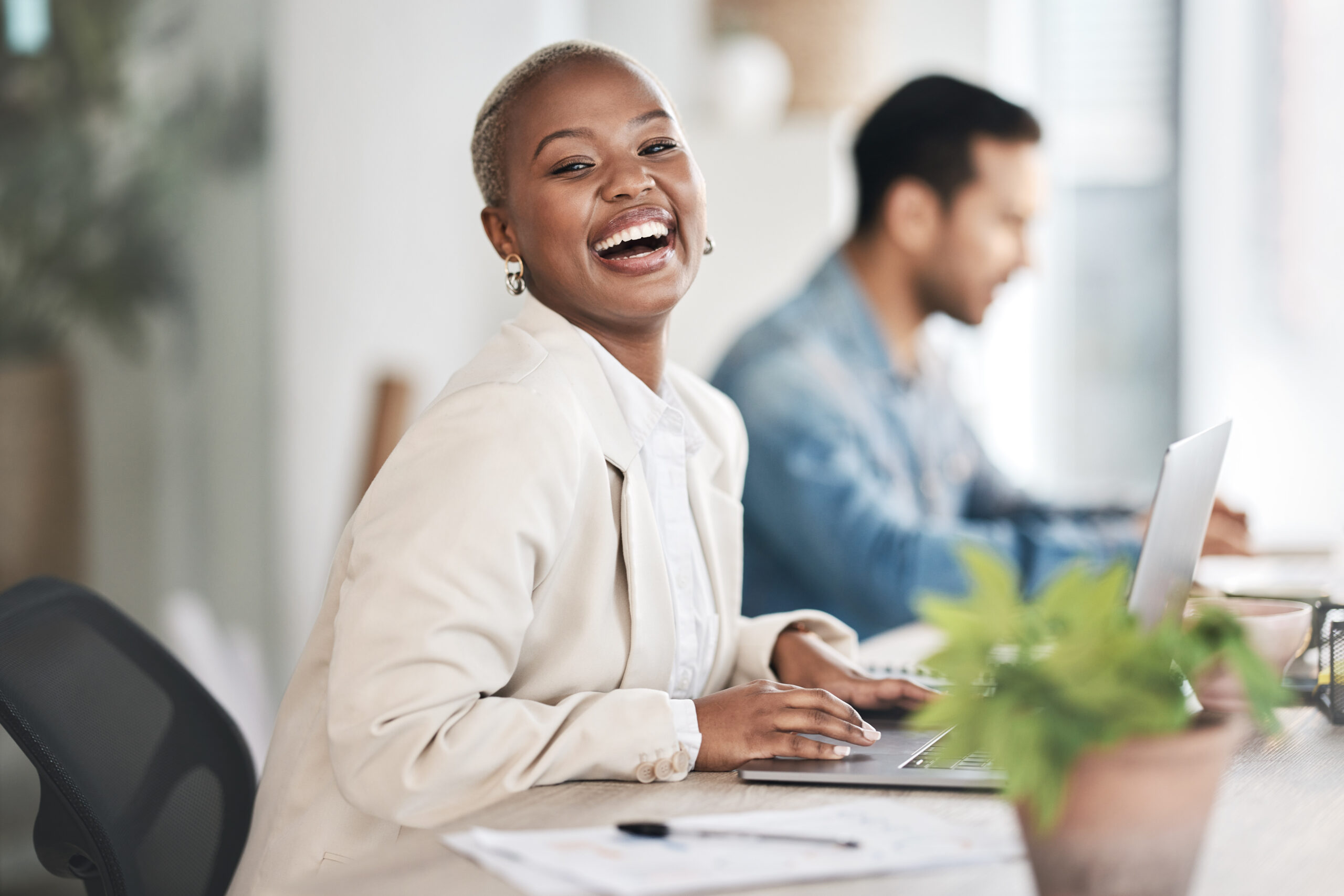 A female employee happy with her full-time job.